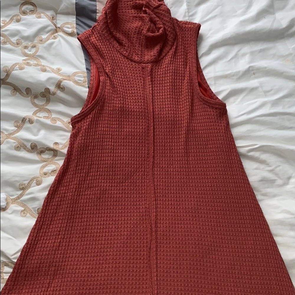 Orange sleeveless dress with high neck